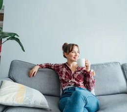 Woman smiling on a couch