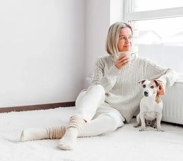 Woman sitting with her pet dog