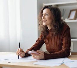 Woman reviewing documents at a desk