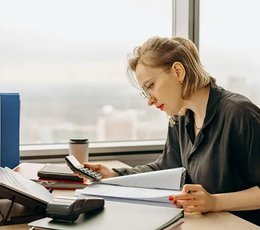 Woman working on financial paperwork
