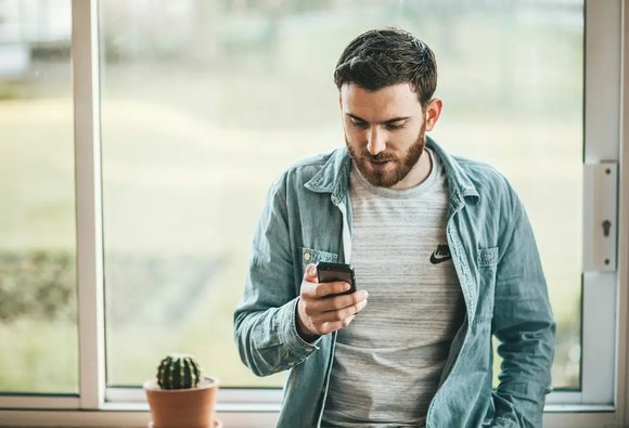 Man checking mortgage options on phone